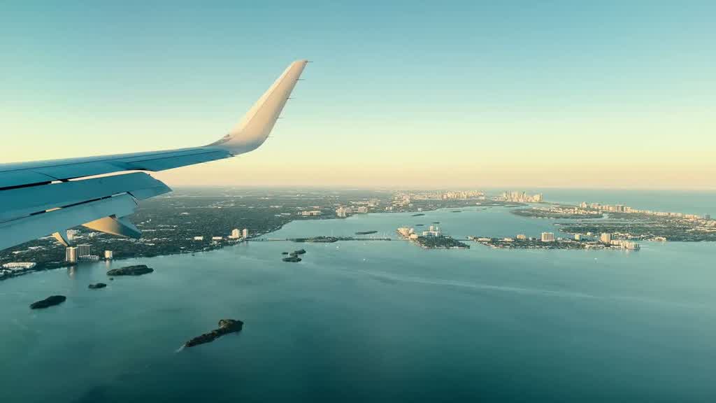 View from an aircraft window on approach over Biscayne Bay into Miami